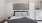 a bed with a large wall decoration above it