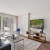a living room with a tv and couches