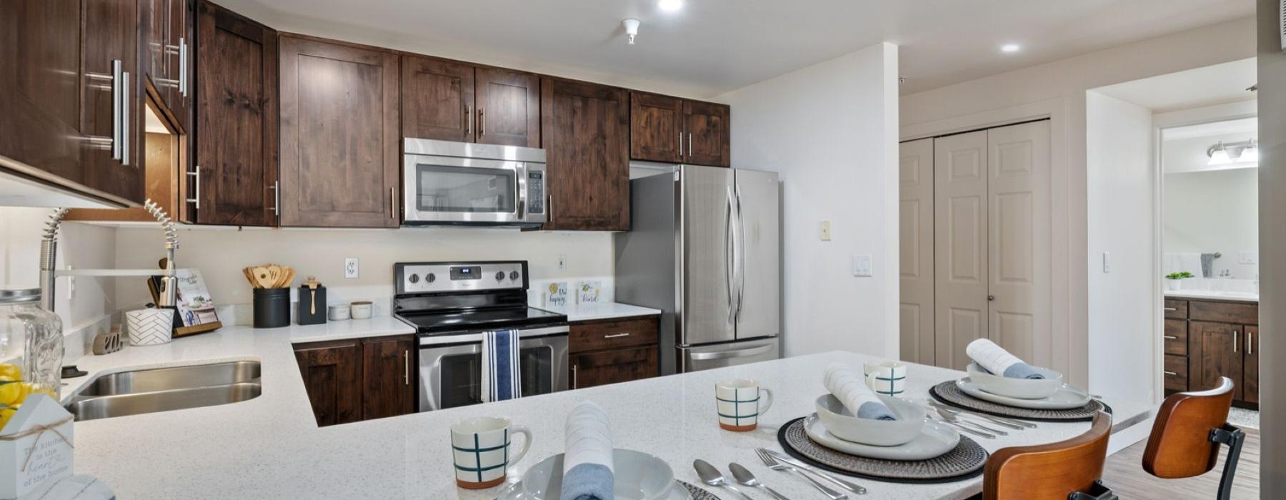 a kitchen with a table set